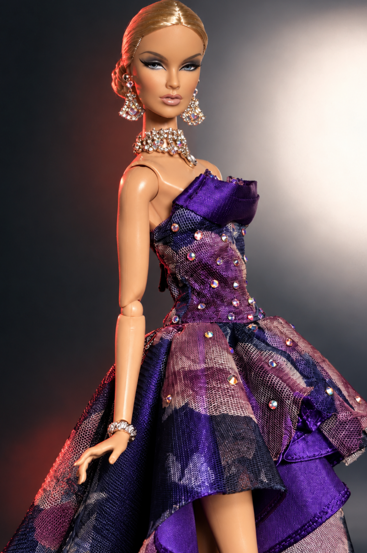 Side detail of violet satin layers and floral mesh on the HAUTE 1:6 doll gown