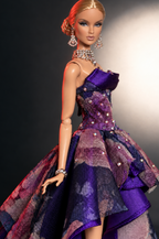 Three-quarter portrait showing the HAUTE purple floral gown's fitted bodice and layered skirt