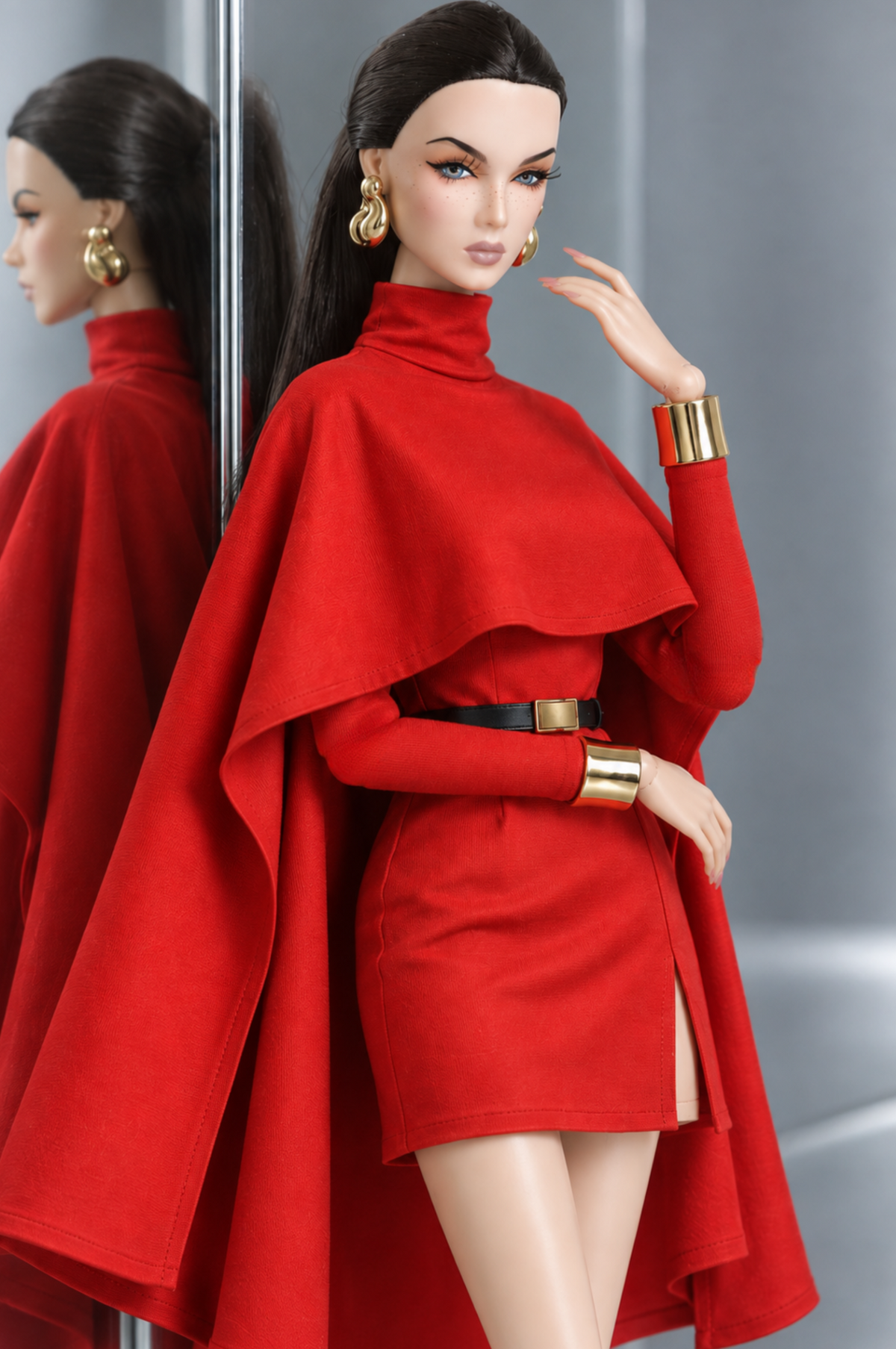 Closer front view of the red LE SALON cape mini dress, showing the high neckline, cape overlay and fitted long sleeves.