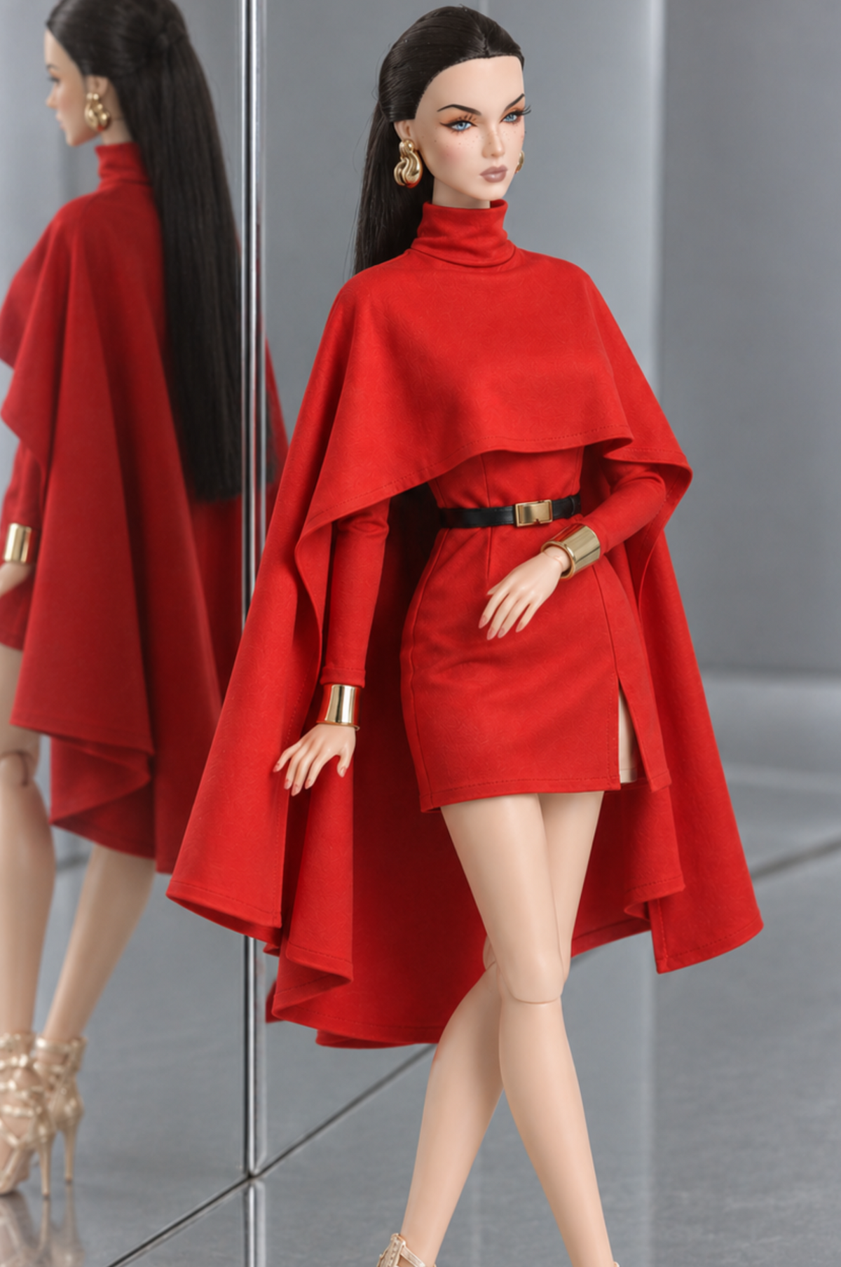 Front three-quarter view of LE SALON No. 01 red high-neck mini dress with long sleeves and a broad cape overlay.