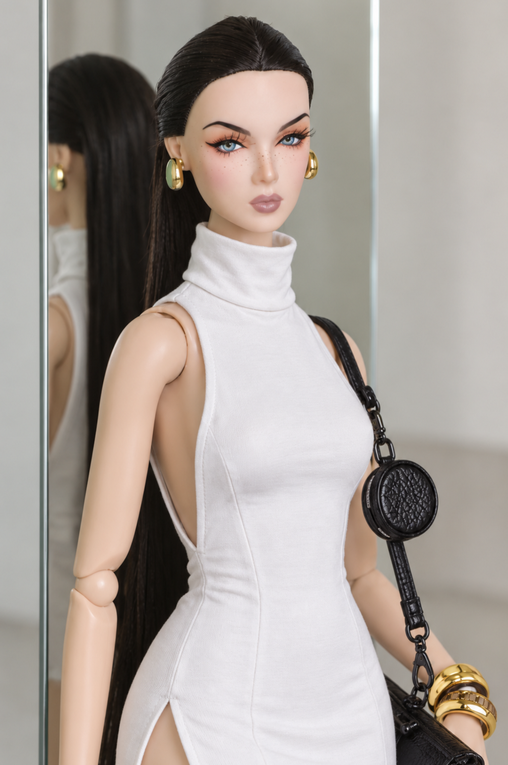 Bodice detail of the white LE SALON mini dress, showing its folded high collar, sleeveless cut and shaping seams.