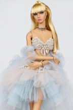Close view of the pearl-effect bodice, central teardrop ornaments, draped bead strands and soft pastel arm tulle.