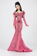 Full-length fashion doll in a pink embellished mermaid gown with floral shoulder accents, long sleeves and a trailing hem.