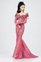Front view of a pink mermaid doll gown showing curved bead patterns across the bodice and long decorated skirt.