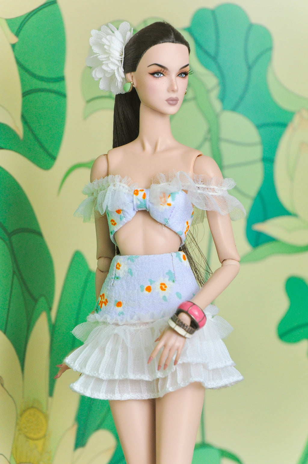 Close view of the Spring Aura bow-front top and tiered white ruffle skirt set