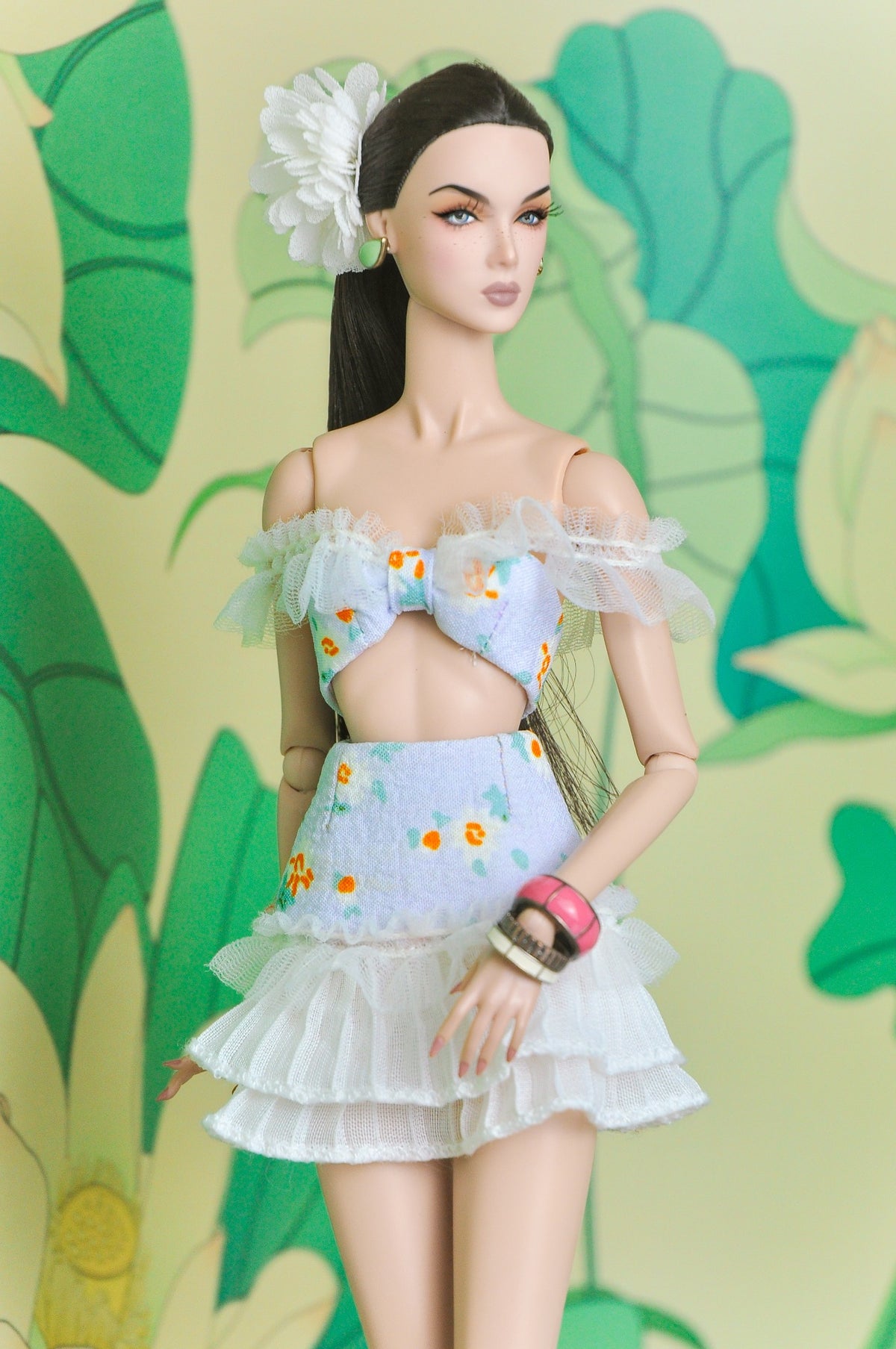 Close view of the Spring Aura bow-front top and tiered white ruffle skirt set