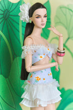 Spring Aura bow top and high-waisted ruffle skirt, three-quarter detail