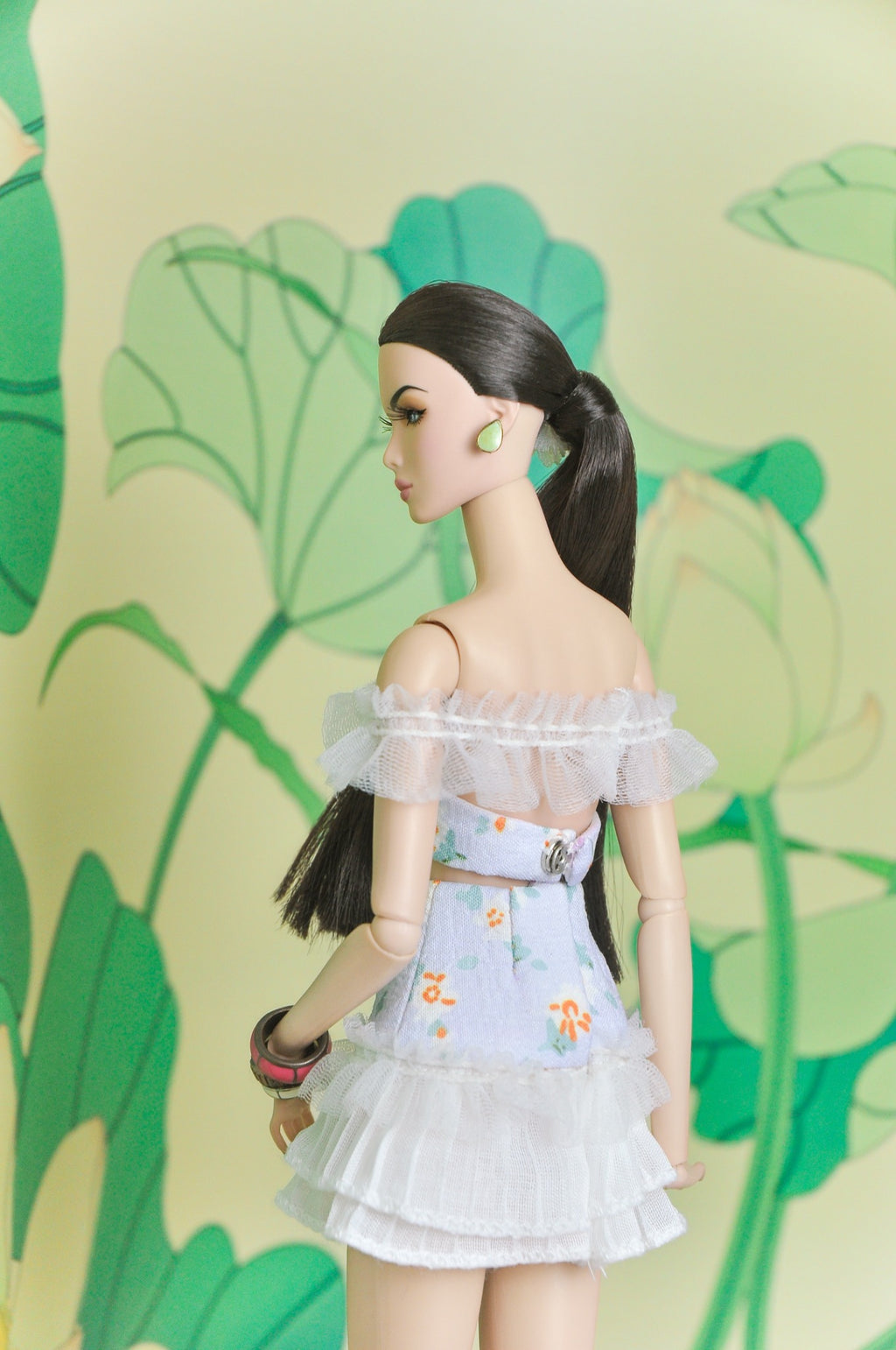 Back view of the Spring Aura floral two-piece doll outfit with off-shoulder ruffles