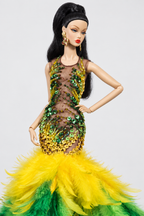 Close view of green and yellow beads and sequins on a sheer brown mesh bodice above the bright yellow feather skirt.