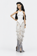Full-length fashion doll wearing a white sculptural bodice and tiered ivory-to-silver beaded fringe skirt, with one hand at the hip.