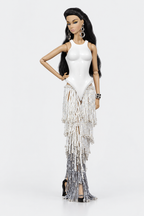 Full-length fashion doll wearing a white sculptural bodice and tiered ivory-to-silver beaded fringe skirt, with one hand at the hip.